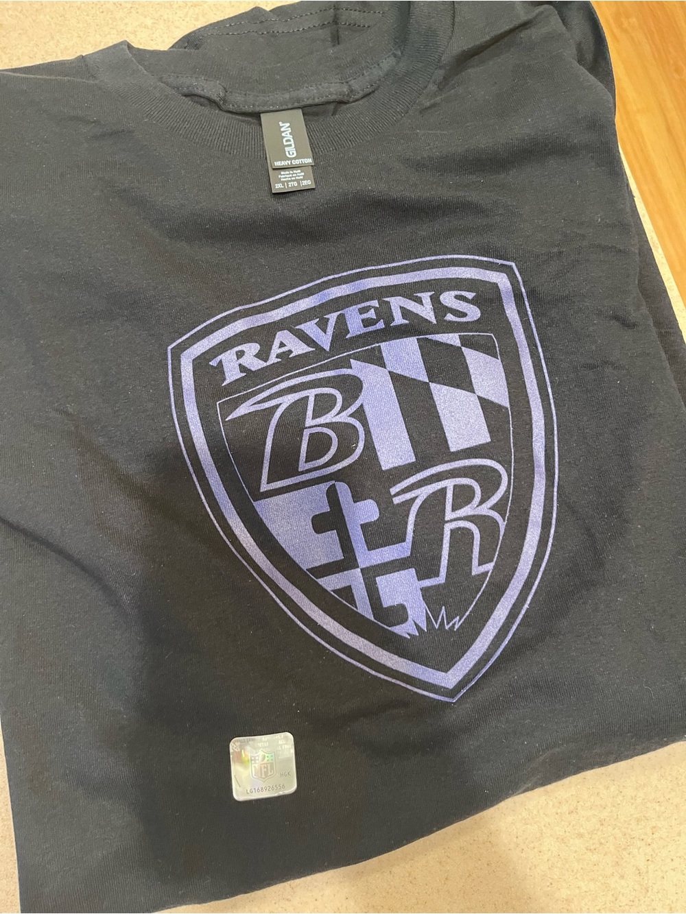 Black Short Sleeve Baltimore Ravens Tee with Purple Ravens Shield Graphic NFL